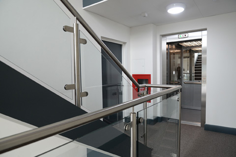 A Stannah passenger lift supported by an FX structure