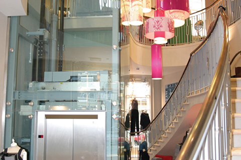 Bespoke glass FX lift structure at Jigsaw Retail Store