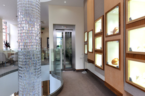 Bespoke glass lift and lift structure within Berry Jewellers in Nottingham