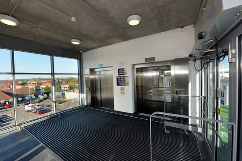 Tough finish vandal resistant passenger lifts within Chequers Way car park