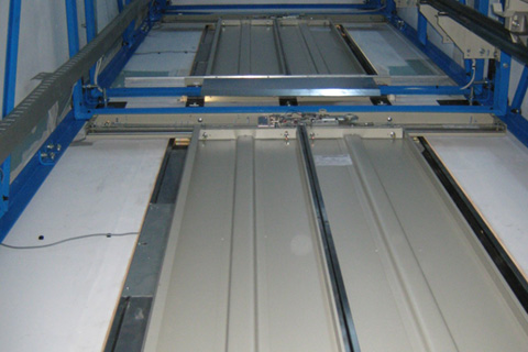 Internal view of the landing doors within a steel structure supported lift shaft