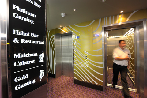 Bespoke passenger lift with glass landing entrances and matching lift interiors at London Hippodrome