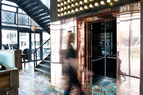Bespoke copper lift car within retail centre ZaZa Bazaar