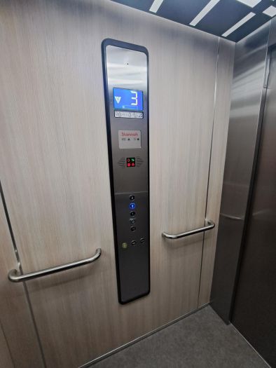 8-person 630kg capacity traction lift features easy to clean car interior with digital display