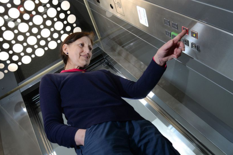 Lift user pressing lift control button