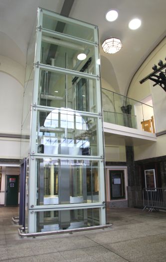 A scenic passenger lift in the Art Deco ticket hall.
