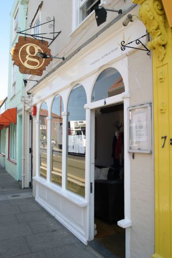 A Microlift in a fully glazed shaft showcases and supports service.